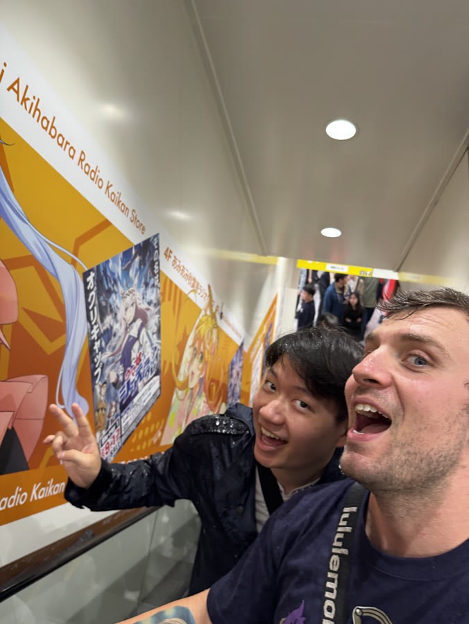 Guests on the escalator inside Akihabara Radio Kaikan, the tower full of figure shops